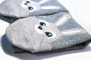 A pair of female socks with a pattern isolated on a white background.