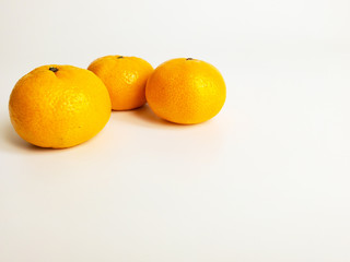 Juicy delicious tangerines isolated on a white background. Orange tangerine delicious and healthy fruit.