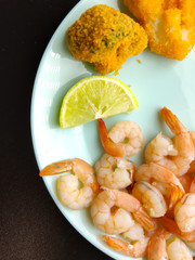 Fresh delicious boiled peeled shrimp. Cooked seafood. Broccoli and shrimp
