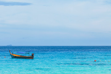 The tour boat is waiting for tourists at sea. at the Similan Islands, Phang Nga, Thailand