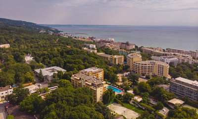 Obraz premium Aerial image a drone resort Golden Sands on Black Sea coast in Bulgaria. Many hotels and beaches with tourists, sunbeds and umbrellas.
