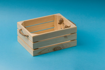Wooden box on blue background.