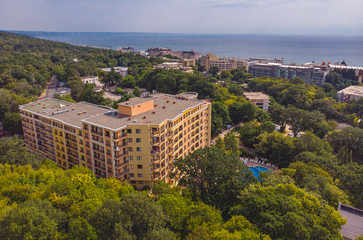 Fototapeta na wymiar Aerial image a drone resort Golden Sands on Black Sea coast in Bulgaria. Many hotels and beaches with tourists, sunbeds and umbrellas.