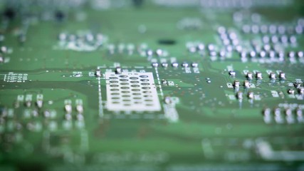 Close-up sliding video of vintage printed circuit board - soldered side. 4k - Powered by Adobe