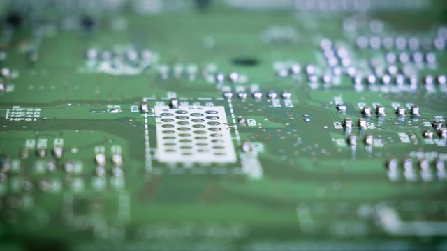 Close-up sliding video of vintage printed circuit board - soldered side. 4k
