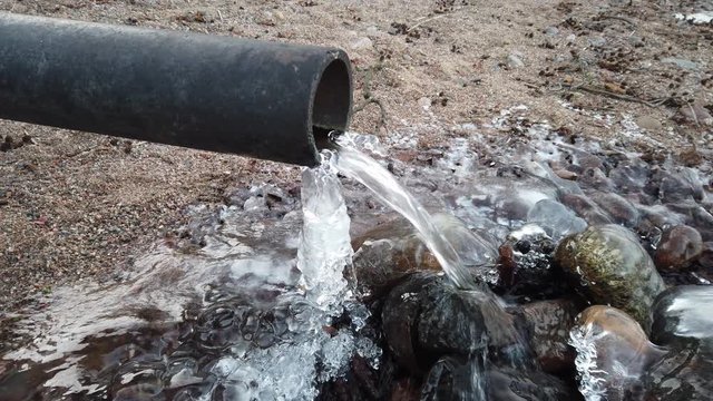 water running out of drain pipe in winter