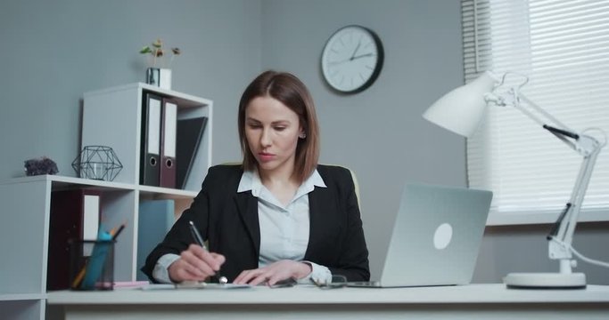 Crumpled pieces of paper. Female office worker throwing crumpled paper, having nervous breakdown at work, screaming in anger, stress management. Businesswoman tearing contract in pieces.