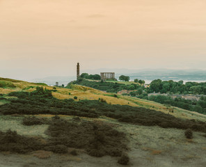 Fototapeta na wymiar Calton Hill Edinburgh as seen from the Arthur's Seat trail