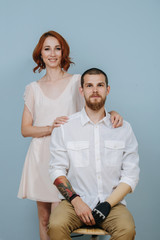 Portrait of a married couple over blue background