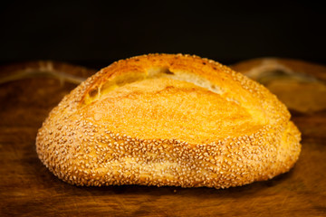 Bread with sesame seeds on the table