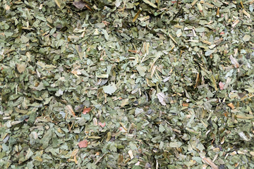 Texture background. Green spice mix dried vegetables and herbs.