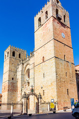 Fototapeta na wymiar Side perspective view of the main facade of the Cathedral of Siguenza with its two bell towers. Aragon, Spain