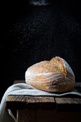 Fresh homemade crisp bread on wooden background. French bread. Bread at leaven. Unleavened bread