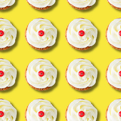 Cakes with cream cheese and cranberries on a yellow background, top view. Isolated, seamless pattern.
