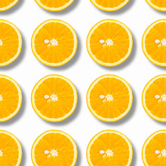 Slices of orange on a white background, top view. Isolated, seamless pattern.