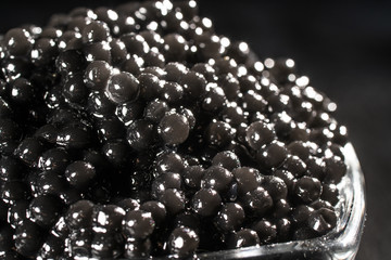 Black Caviar background. High quality real natural sturgeon black caviar close-up.