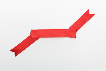 top view of red decorative ribbon isolated on white