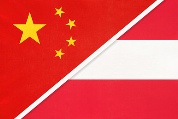 China or PRC vs Austria national flag from textile. Relationship between asian and european countries.