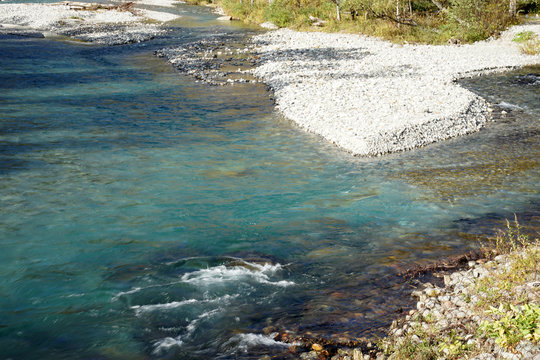 Beautiful crystal clear water river landscape with mountain background in Japan Alps Kamikochi, Nagano, Japan