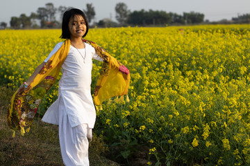 child and mustard flower