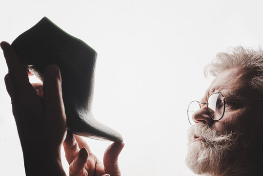 Senior Cobbler In Glasses Holding Shoe Last Isolated On White