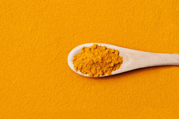 Turmeric powder is orange in color. Natural, useful healing spice from the East. Curcuma