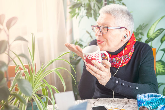 Old Lady Blowing A Kiss, Having Her Morning Coffee And Listening To Her Favorite Song