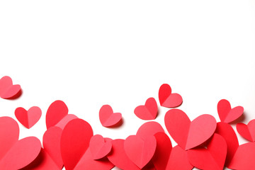 Cut out of red paper hearts on white background isolated.