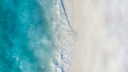 Summer seascape beautiful waves, blue sea water in sunny day. Top view from drone. Sea aerial view,...