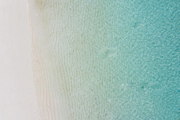 Beach perfect white sand turquoise water top view, aerial landscape, calm sea waves and clear water view