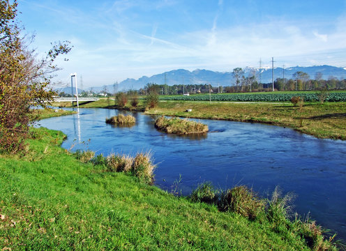 The river Rheintaler Binnenkanal in a village of R&uuml;thi SG (Ruthi SG or Ruethi SG) and in the Rhine river valley (Rheintal) - Canton of St. Gallen (SG), Switzerland