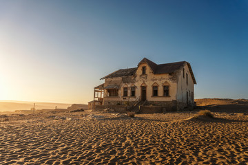 Sunrise above an abandoned house in Kolmanskop ghost town, Namibia
