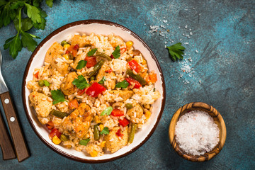 Rice with chicken and vegetables top view.