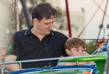 people, Boy, Caucasian, Playing in Toy, Carousel, Amusement Park