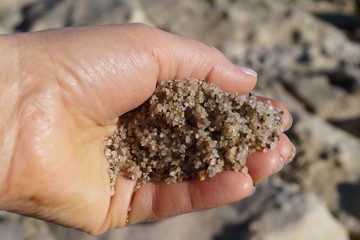 sea sand in hand closeup