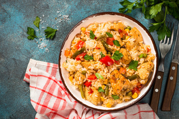 Rice with chicken and vegetables top view.