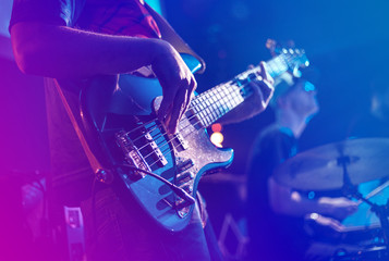 Close up of electric guitar during rock concert - obrazy, fototapety, plakaty