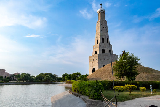 wide shot of fateh burj with lake against blue sky in the background. nature and out door concept.