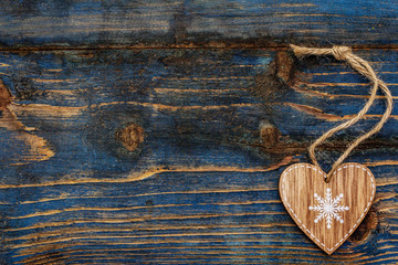Love concept for Valentines day. Card with space for text. Natural heart, old wooden boards background