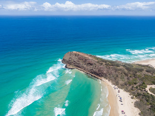 High angle aerial drone view of famous Indian Head headland which marks both the most easterly point on the island and the northern end of 75 Mile Beach on Fraser Island, Queensland, Australia.