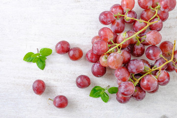Red grapes on a white background