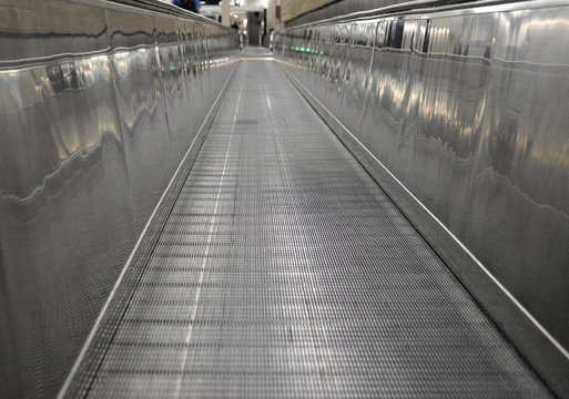 Long and Empty Walkway inside an aiport while connecting flights