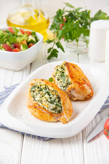 Chicken fillet stuffed with cottage cheese (ricotta, feta) and herbs (parsley, spinach, dill). Delicious homemade food, healthy