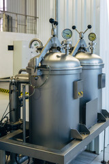Cylinder with gas in and hop dispenser with manometers in modern brewery