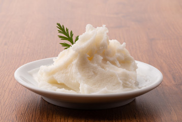 small plate of lard on wooden table