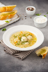 Soup with meatballs, vegetables and vermicelli. Children's Italian food with pasta and meat (chicken, Turkey)