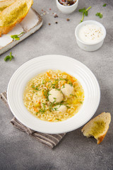 Soup with meatballs, vegetables and vermicelli. Children's Italian food with pasta and meat (chicken, Turkey)