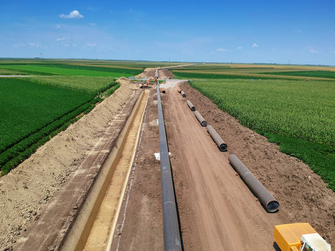 Aerial View Of Natural Gas Pipeline Construction In Cultivated Agricultural Farm Field - Turkish Stream