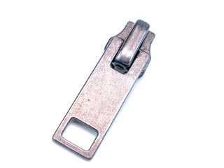 Zipper slider on a white background. Place for text. Free place. Macro photo. © malaha