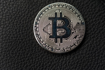 Close-up of a silver Bitcoin coin